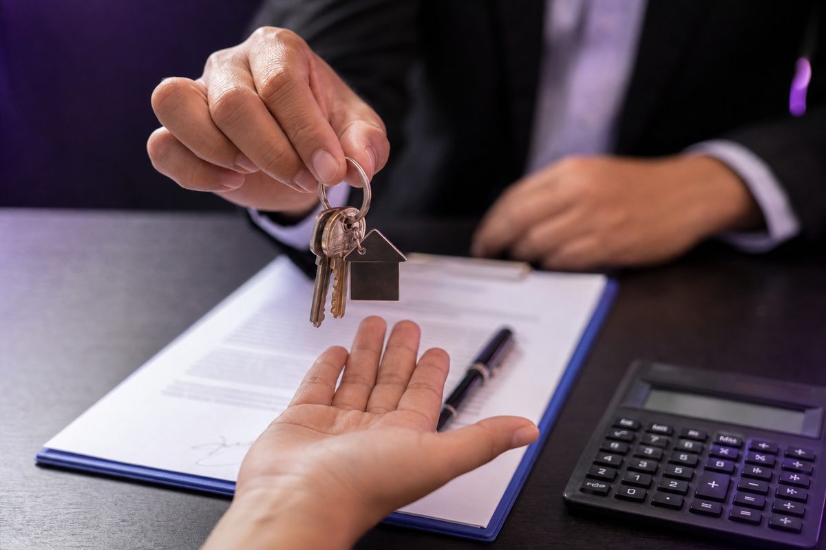 Keys handed over a signed loan document